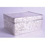 A SMALLER 19TH CENTURY JAPANESE MEIJI PERIOD SILVER BOX AND COVER decorated with scrolling foliage a