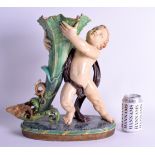 A LARGE 19TH CENTURY MINTON MAJOLICA FIGURAL GROUP modelled as a young boy holding aloft a cornucopi