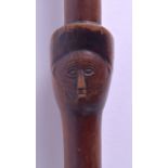 AN EARLY 20TH CENTURY AFRICAN CARVED HARDWOOD TRIBAL STAFF with portrait to centre stem. 91 cm long.