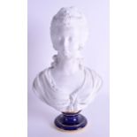 A 19TH CENTURY FRENCH SEVRES BISQUE PORCELAIN BUST OF A FEMALE modelled upon a blue circular base. 3