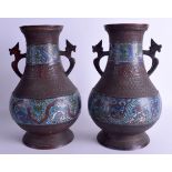 A PAIR OF 19TH CENTURY CHINESE TWIN HANDLED BRONZE CHAMPLEVE ENAMEL VASES decorated with stylised dr