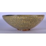 A LARGE AMERICAN STUDIO POTTERY BOWL, decorated with speckled blue body, impressed "H" marks to base