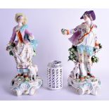 A LARGE PAIR OF 18TH CENTURY CHELSEA DERBY FIGURES OF A MALE AND FEMALE one standing beside a dog, o