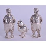 AN ANTIQUE CONTINENTAL SILVER CHICK PEPPERETTE together with a pair of German silver Dutch boy condi