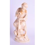 A 19TH CENTURY JAPANESE MEIJI PERIOD CARVED IVORY OKIMONO modelled as a male holding a hoe. 14 cm hi