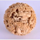 A FINE 19TH CENTURY JAPANESE MEIJI PERIOD CARVED IVORY SPHERE wonderfully decorated all over with dr