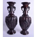 A PAIR OF 19TH CENTURY JAPANESE MEIJI PERIOD TWIN HANDLED BRONZE VASES decorated with birds amongst