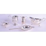 A SILVER FLUTED CHRISTENING MUG together with a silver sauce boat, silver strainer etc. 10 oz. (5)