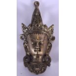 A CHINESE SINO TIBETAN SILVERED METAL WALL MASK OR PLAQUE, formed with elongated ears wearing crown.