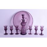 AN UNUSUAL VICTORIAN SCOTTISH AMETHYST GLASS LIQUIOR SET comprising of decanter, six glasses & tray