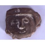 A PRE COLUMBIAN POTTERY MASK OR PLAQUE, forming the face of a male. 6.8 cm wide.