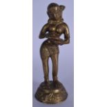 AN EARLY 20TH CENTURY INDIAN BRONZE STATUE OR BUDDHA, modelled standing holding an object upon a cir