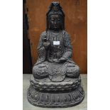 A LARGE BRONZE STATUE OF A SEATED BUDDHA, modelled a vessel. 58 cm high.