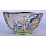 A 19TH CENTURY CHINESE CANTON ENAMEL BOWL, decorated with figures in panels and foliage. 12 cm wide.