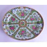 A LARGE 19TH CENTURY CHINESE CANTON FAMILLE ROSE SERVING DISH Qing, painted with floral bandings and