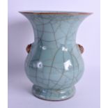 AN EARLY 20TH CENTURY CHINESE GE TYPE CELADON VASE with mask head handles. 18 cm x 15 cm.