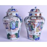 A GOOD PAIR OF 19TH CENTURY CHINESEW WUCAI VASES AND COVERS Transitional style, painted with immorta