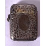 A SOLID SILVER VESTA CASE BEARING BIRMINGHAM HALLMARKS, engraved with extensive foliage. 5.2 cm x 4.