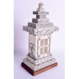 AN UNUSUAL 19TH CENTURY JAPANESE MEIJI PERIOD CARVED IVORY BUDDHA PAGODA decorated with flowers. Ivo