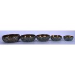 A SET OF FIVE ISLAMIC HARDSTONE INLAY STACKING BOWLS, of flattened form. Largest 11.5 cm.