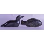 A NORTH AMERICAN INUIT CARVED SOAPSTONE DUCK together with a similar fish. 17 cm & 16 cm wide. (2)