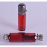 A VICTORIAN SILVER MOUNTED RUBY GLASS SCENT BOTTLE together another similar. 9 cm & 8.5 cm long. (2)