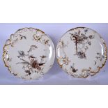 A PAIR OF FRENCH LIMOGES AESTHETIC MOVEMENT PORCELAIN PLATES, decorated with foliage and gilt highli