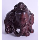 AN EARLY 20TH CENTURY CHINESE CARVED HARDWOOD FIGURE OF AN ELEPHANT possibly Zitan. 10 cm x 10 cm.