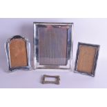 AN ENGLISH ART NOUVEAU SILVER PHOTOGRAPH FRAME together with three other silver frames. Various date