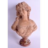 AN 18TH/19TH CENTURY FRENCH CARVED TERRACOTTA BUST modelled as a pretty female upon a veined marble