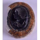 A 19TH CENTURY GRAND TOUR CARVED MINERAL STONE CAMEO depicting a male above inscription in the antiq