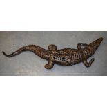 AN UNUSUAL LATE VICTORIAN/EDWARDIAN TAXIDERMY CROCODILE. 130 cm long.