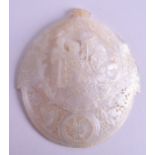 A 19TH CENTURY CARVED MOTHER OF PEARL JERUSALEM BETHLEHEM SHELL PLAQUE depicting figures and foliage