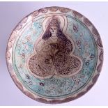 A CENTRAL ASIAN PERSIAN MIDDLE EASTERN KASHAN BOWL painted with a seated female amongst foliage. 22.