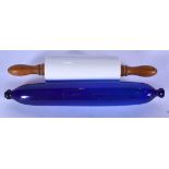 A BRISTOL BLUE GLASS ROLLING PIN, together with a ceramic example with turned wooden handles. Larges