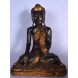 A LARGE SOUTHEAST ASIAN WOODEN FIGURE OR STATUE OF BUDDHA, modelled seated upon a triangular base in