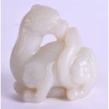 A GOOD 19TH CENTURY CHINESE CARVED GREENISH WHITE JADE FIGURE OF A BEAST Late Qing, modelled as a ro