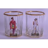 A PAIR OF EARLY 19TH CENTURY AUSTRO GERMAN ENAMELLED GLASSES painted with figures under a gilt rim.