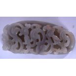 A CHINESE PALE JADE PLAQUE OR BUCKLE, carved with thick scrolling foliage. 14 cm wide.