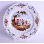 A 19TH CENTURY FRENCH LILLE POTTERY SCALLOPED PLATE bearing pseudo 1767 marks to base, painted with