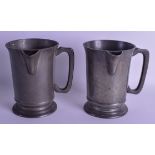 A PAIR OF 18TH/19TH CENTURY CONTINENTAL PEWTER JUGS one bearing a monogram. 16 cm high.