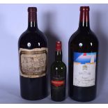 TWO LARGE VINTAGE EMPTY BOTTLES OF WINE, together with a smaller example. Pair 48 cm. (3)