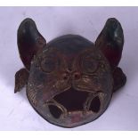 AN UNUSUAL EARLY 20TH CENTURY METAL CAT MASK, formed wearing earrings. 17 cm wide.