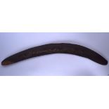 A 19TH/20TH CENTURY ABORIGINAL AUSTRALIAN BOOMERANG, carved with animals. 48.5 cm wide.