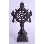 A 19TH CENTURY INDIAN BUDDHISTIC BRONZE RITUAL ORNAMENT decorated with a central floral motif. 19 cm