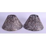 A PAIR OF 19TH CENTURY CONTINENTAL SILVER ROCOCO SHADES. 2.5 oz. 8.5 cm x 11 cm.