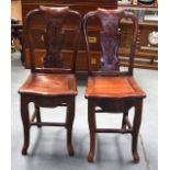 A PAIR OF EARLY 20TH CENTURY CHINESE ROSE WOOD CHAIRS, carved with foliate backsplat. 88 cm high.