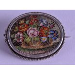 A GOOD 19TH CENTURY ITALIAN MICRO MOSAIC SILVER BROOCH decorated with flowers. 3.5 cm x 3 cm.