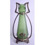 AN ART NOUVEAU PEWTER AND GREEN GLASS VASE in the manner of WMF, of scrolling organic form. 36 cm hi