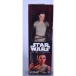 A BOXED STAR WARS FIGURE OF REY JAKKU, of "The Force Awakens". 30 cm high.